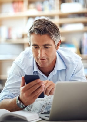 businessman-on-mobile-web-shutterstock_2531383337